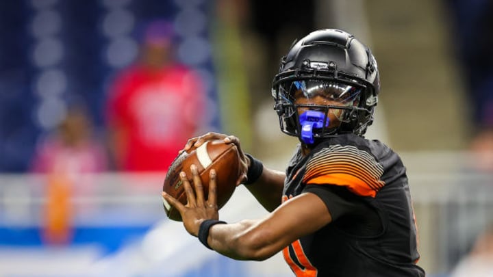 Belleville quarterback Bryce Underwood throws a pass in the 2022 MHSAA Division 1 title game. Photo by Mariusz Nowak