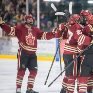 Maple Grove boys hockey celebrates a goal