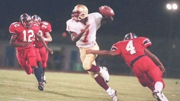 Warwick High School Quarterback Michael Vick scrambling against Denbigh High School Warwick High School Quarterback Michael Vick scrambling against Denbigh High School