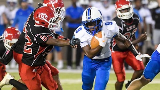 Auburn High School s Ean Nation (9) carries against Lee during their game at Cramton Bowl in Montgomery, Ala., on Thursday Se