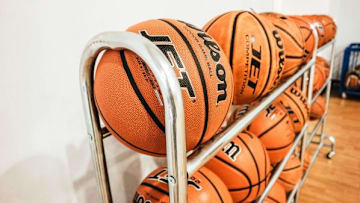 A Simi Valley man who worked as an assistant basketball coach at a local high school has been charged with committing lewd acts involving two teenage girls.