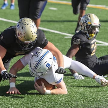 Birmingham Charter's Eddie Plaza makes a tackle against Acalanes in the 2023 CIF State D3-AA final.