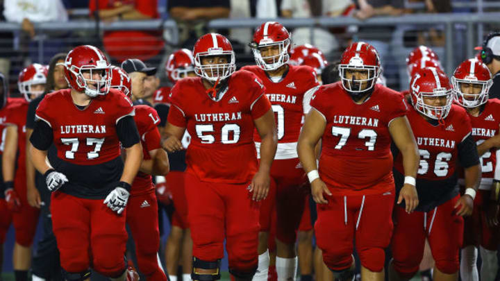 Orange Lutheran offensive linemen take the field against Sierra Canyon in 2023.