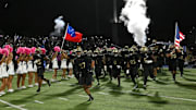 St. John Bosco football team runs out on the field against Mater Dei in 2023.