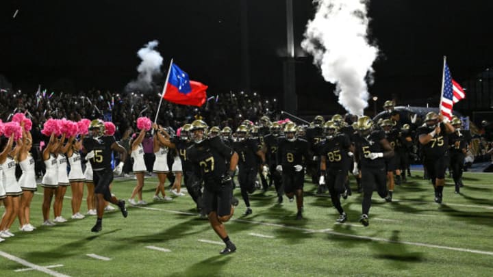 St. John Bosco football team runs out on the field against Mater Dei in 2023.