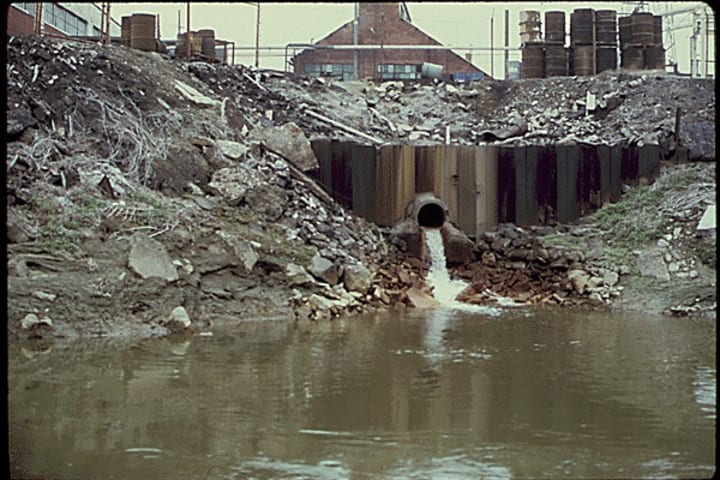 A drainage pipe empties wastewater into the Cuyahoga River in 1973