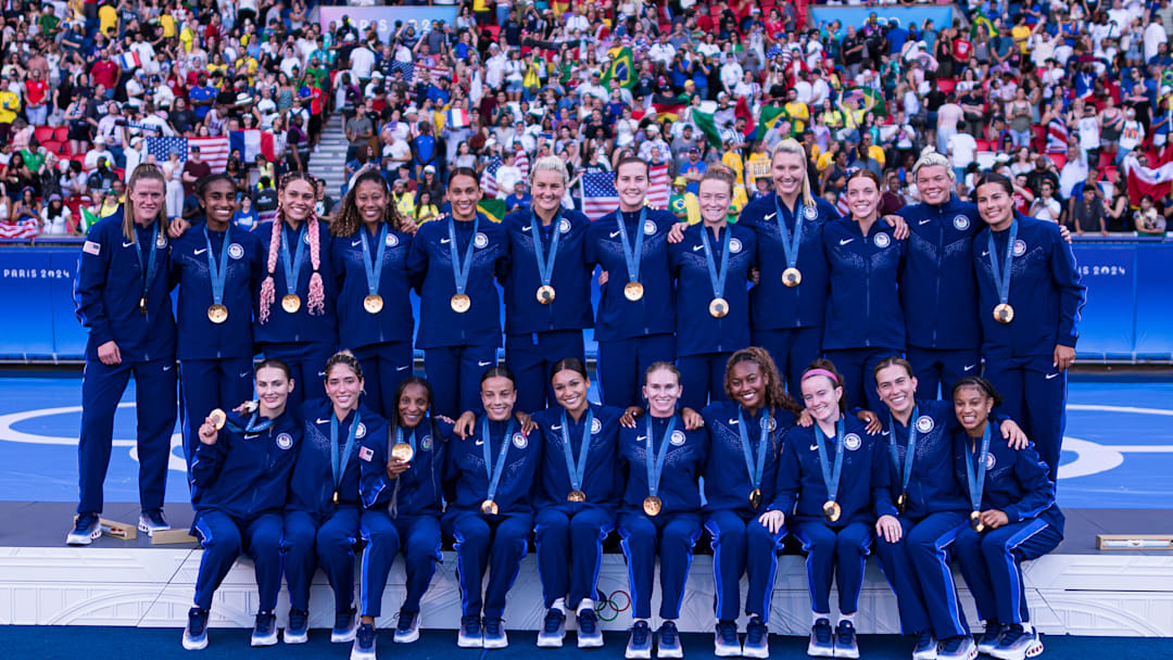 USWNT with their gold medals after the 2024 Olympic final v Brazil 