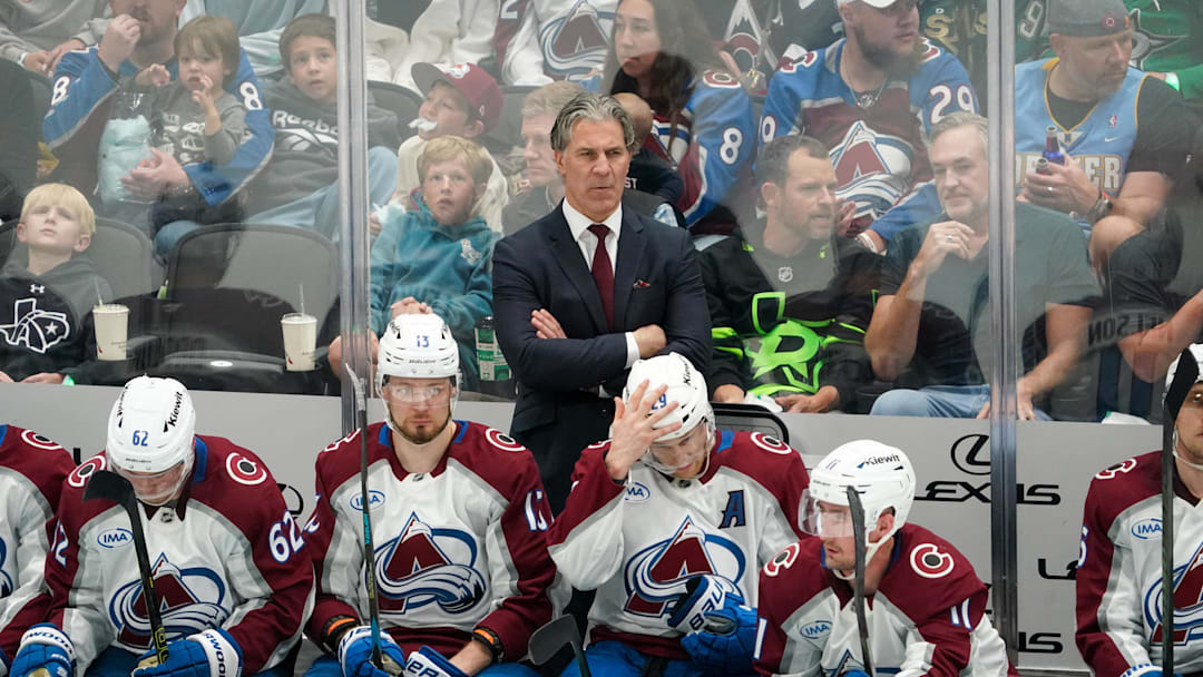 Apr 19, 2025; Dallas, Texas, USA; Colorado Avalanche head coach Jared Bednar stands behind his team on the bench during game one of the first round of the 2025 Stanley Cup Playoffs against the Dallas Stars at American Airlines Center. Mandatory Credit: Raymond Carlin III-Imagn Images