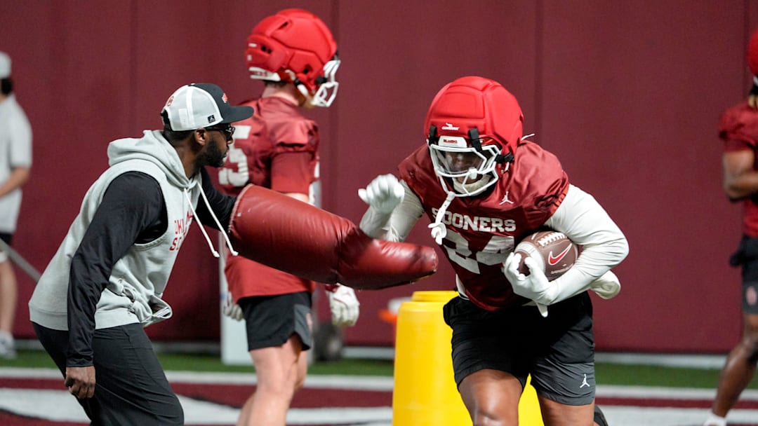 Xavier Robinson (24) runs rills during an Oklahoma (OU) football practice in Norman, Okla., on Wednesday, March 25, 2026.