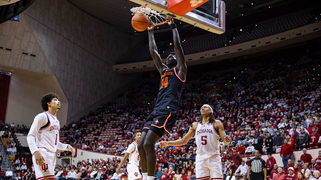 Dec 3, 2024; Bloomington, Indiana, USA; Sam Houston State Bearkats forward Kalifa Sakho (34) shoots the ball while Indiana Hoosiers forward Malik Reneau (5) defends in the second half at Simon Skjodt Assembly Hall. Mandatory Credit: Trevor Ruszkowski-Imagn Images