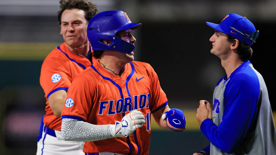 Florida infielder Brendan Lawson (11) reacts to scoring during the ninth inning of an NCAA college baseball matchup