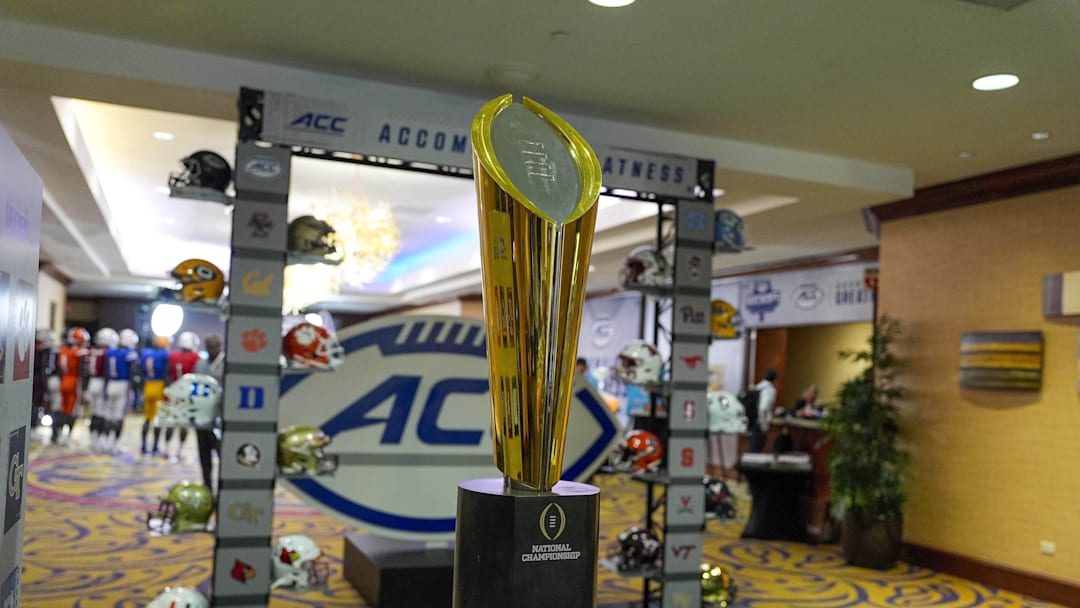 Jul 22, 2024; Charlotte, NC, USA; The CFP National Championship trophy is seen during the ACC Kickoff at Hilton Charlotte Uptown. Mandatory Credit: Jim Dedmon-Imagn Images