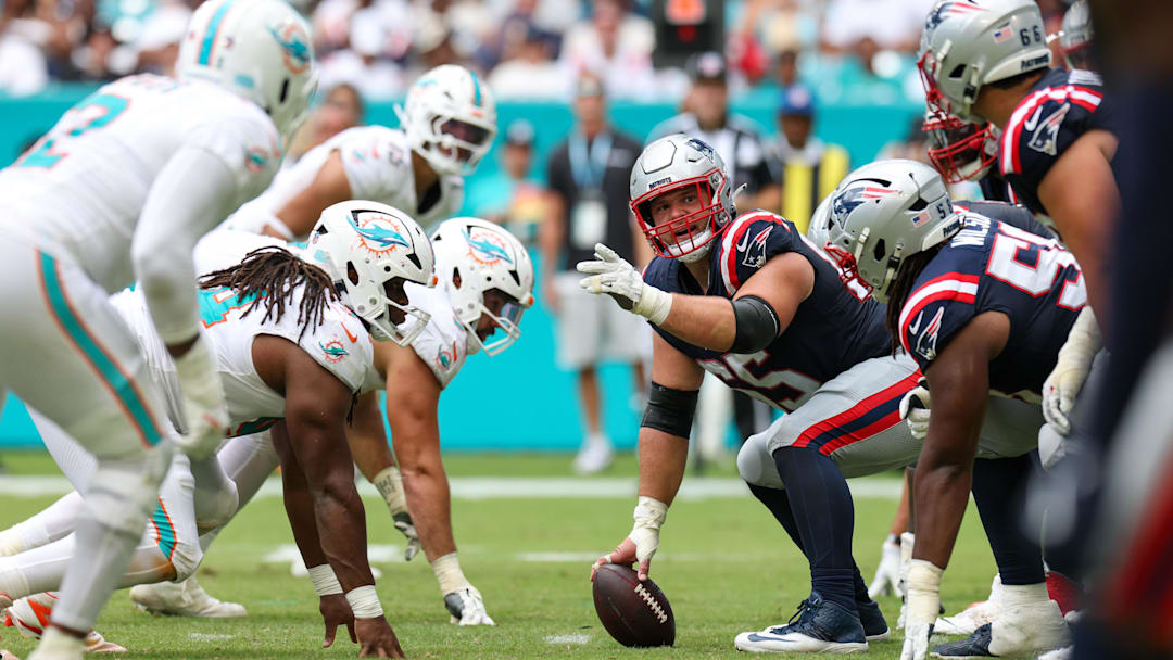 Sep 14, 2025; Miami Gardens, Florida, USA; New England Patriots center Garrett Bradbury (65) lines up against the Miami Dolphins in the fourth quarter at Hard Rock Stadium. Mandatory Credit: Nathan Ray Seebeck-Imagn Images Sep 14, 2025; Miami Gardens, Florida, USA; New England Patriots center Garrett Bradbury (65) lines up against the Miami Dolphins in the fourth quarter at Hard Rock Stadium. Mandatory Credit: Nathan Ray Seebeck-Imagn Images