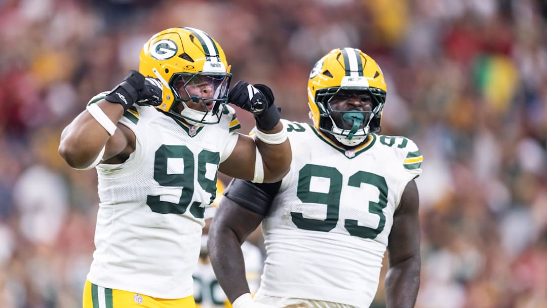 Oct 19, 2025; Glendale, Arizona, USA; Green Bay Packers defensive lineman Barryn Sorrell (99) and Nazir Stackhouse (93) celebrate a play against the Arizona Cardinals in the second half at State Farm Stadium. Mandatory Credit: Mark J. Rebilas-Imagn Images