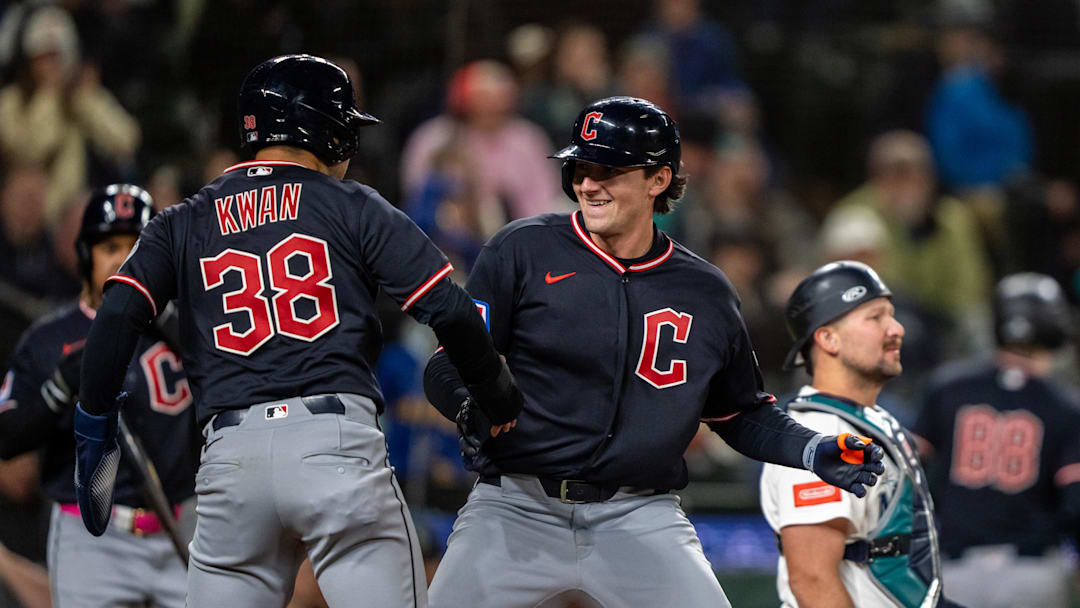 Mar 28, 2026; Seattle, Washington, USA; Cleveland Guardians designated hitter Chase DeLauter (24) celegbrates with centerfielder Steven Kwan (38) after hitting a two-run home run during the tenth inning against the Seattle Mariners at T-Mobile Park. Mandatory Credit: Stephen Brashear-Imagn Images
