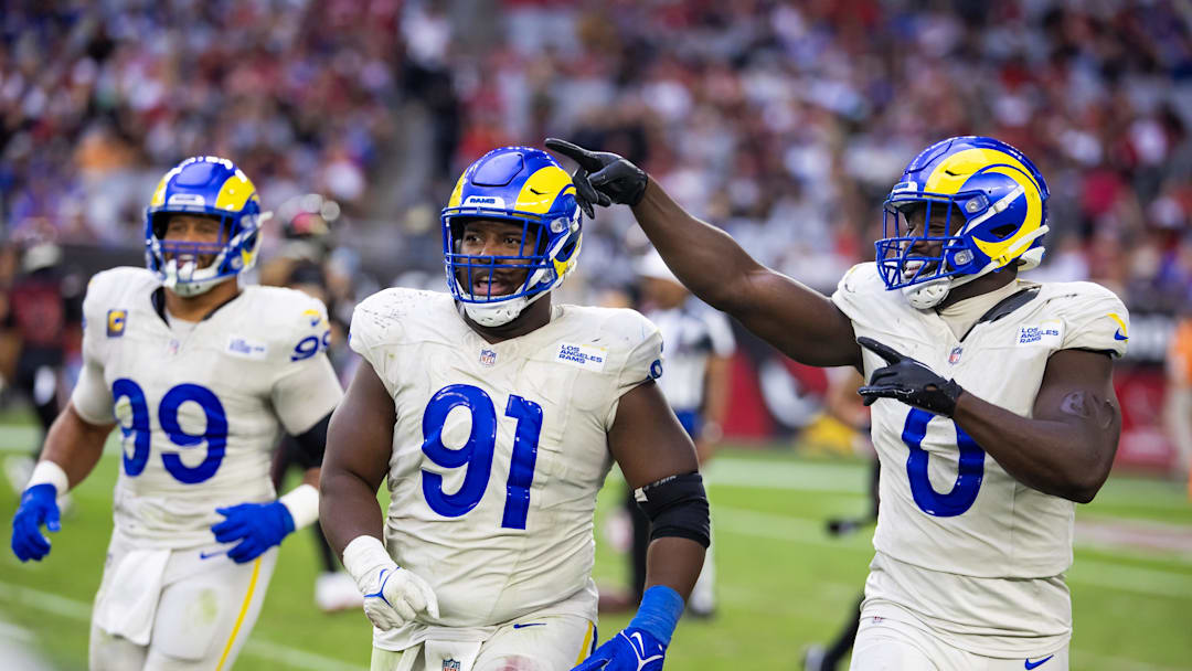 Los Angeles Rams defensive tackle Kobie Turner (91) with linebacker Byron Young (0) and defensive tackle Aaron Donald (99)