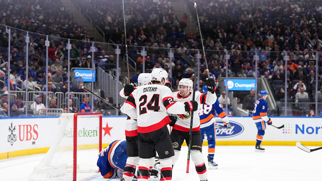 Apr 11, 2026; Elmont, New York, USA; Ottawa Senators center Dylan Cozens (24), right wing Drake Batherson (19), Ottawa Senators right wing Claude Giroux (28) and Ottawa Senators defenseman Jake Sanderson (85) celebrate a goal against the New York Islanders in the third period at UBS Arena. Mandatory Credit: Alexander Wohl-Imagn Images