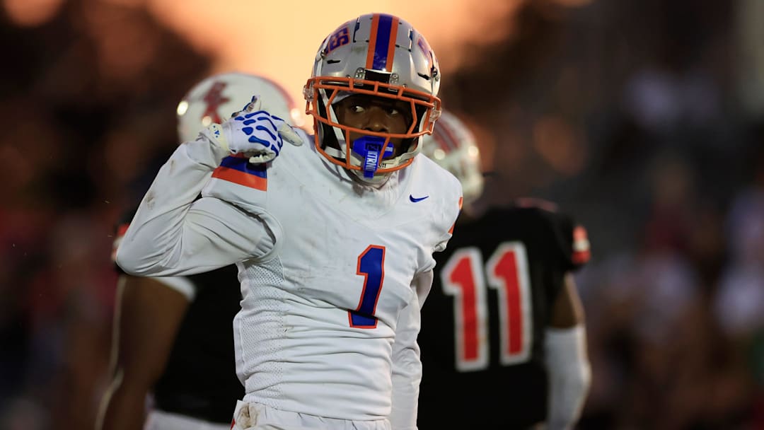Bolles' Naeem Burroughs (1) reacts to his carry during the second quarter of a high school football matchup at Bishop Kenny High School, Friday, Sept. 12, 2025, in Jacksonville, Fla. The Bolles Bulldogs blanked the Bishop Kenny Crusaders 36-0.