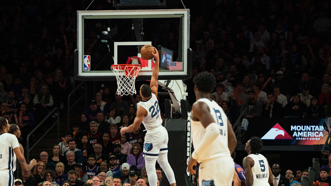 Memphis Grizzlies guard Desmond Bane (22) dunks against the Phoenix Suns during the fourth period at Footprint Center. 