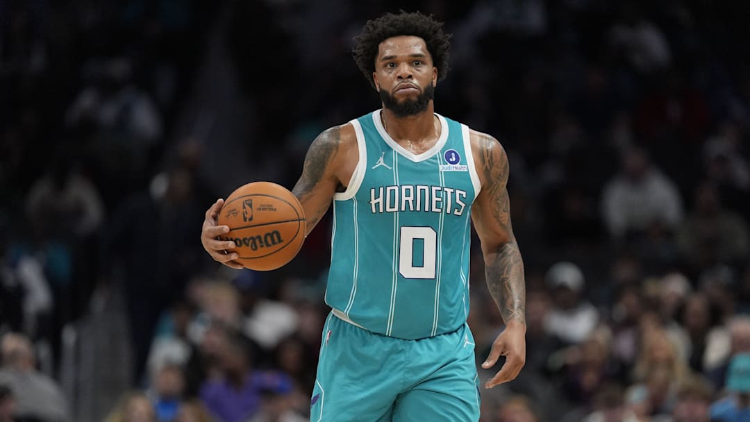 Nov 1, 2025; Charlotte, North Carolina, USA; Charlotte Hornets forward Miles Bridges (0) brings the ball up court against the Minnesota Timberwolves during the first quarter at Spectrum Center. Mandatory Credit: Jim Dedmon-Imagn Images