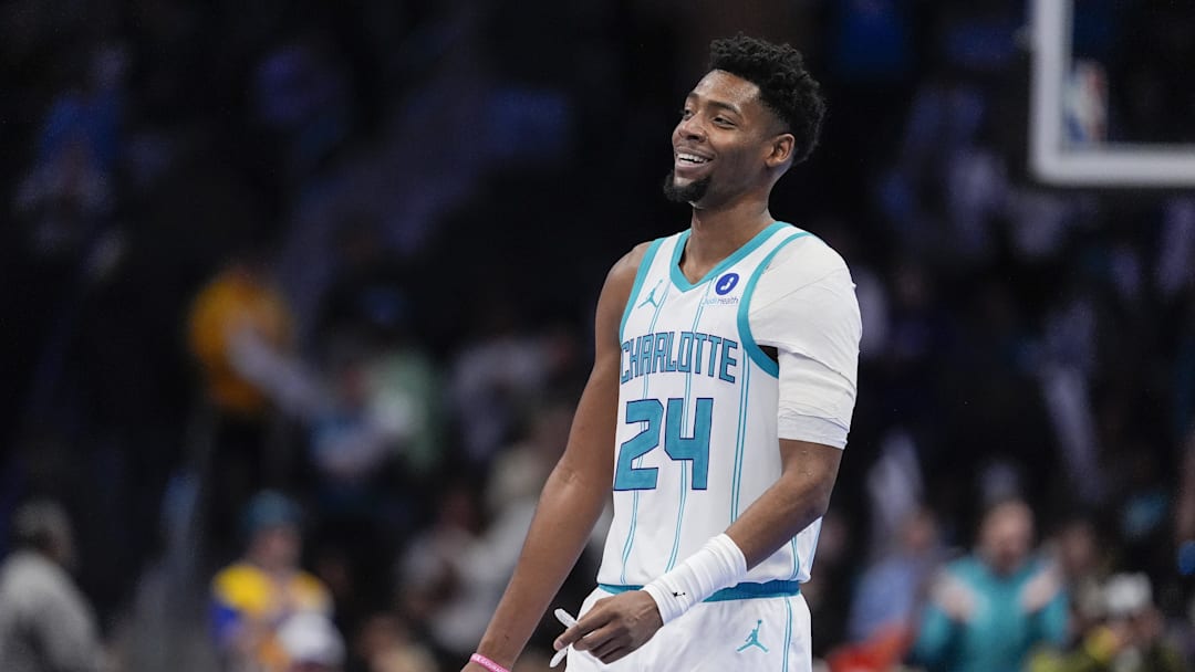 Feb 2, 2026; Charlotte, North Carolina, USA;  Charlotte Hornets forward Brandon Miller (24) smiles in the final seconds of the come from behind win against the New Orleans Pelicans during the second half at the Spectrum Center. Mandatory Credit: Jim Dedmon-Imagn Images