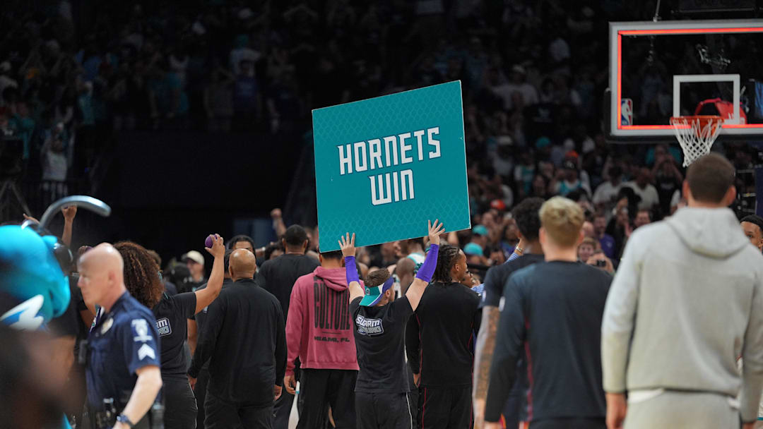 Apr 14, 2026; Charlotte, North Carolina, USA; Charlotte Hornets staff and cheerleaders react to the overtime win during during the play-in rounds between the Charlotte Hornets and the Miami Heat of the 2026 NBA Playoffs at Spectrum Center. Mandatory Credit: Jim Dedmon-Imagn Images