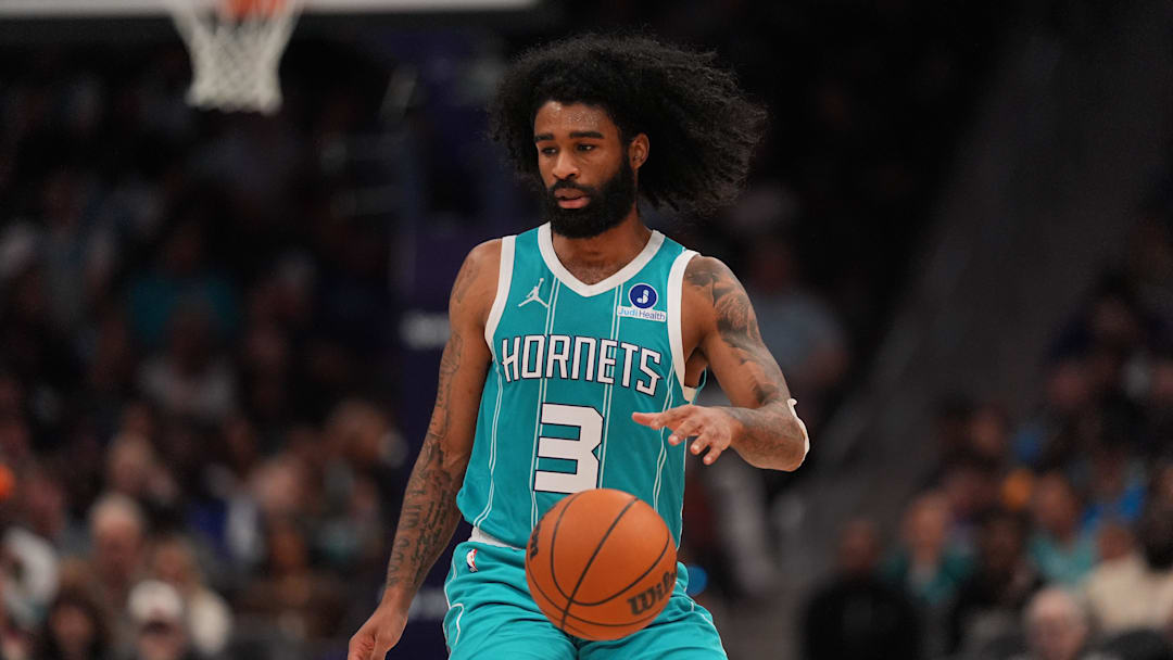 Charlotte Hornets guard Coby White (3) dribbles the ball against the Phoenix Suns 