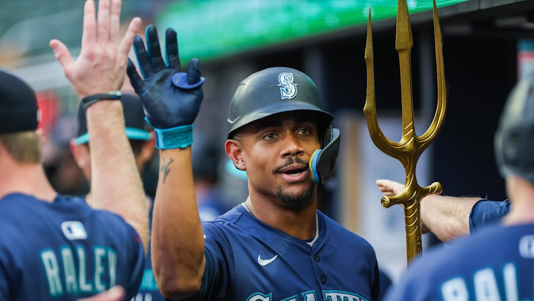 Sep 6, 2025; Cumberland, Georgia, USA; Seattle Mariners outfielder Julio Rodriguez (44) celebrates with teammates in the dugout after scoring against the Atlanta Braves during the first inning at Truist Park. Mandatory Credit: Jordan Godfree-Imagn Images