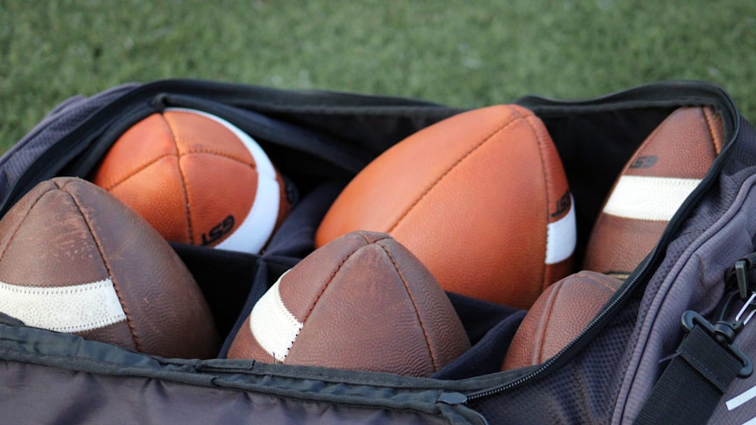 STOCK | Footballs rest in a bag at a high school football game between St. Augustine and Bolles in Jacksonville, Florida, on August 25, 2023. [Clayton Freeman/Florida Times-Union]