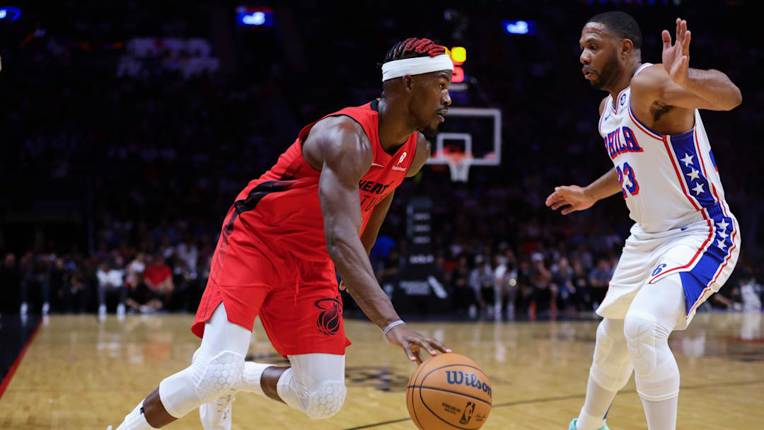 Nov 18, 2024; Miami, Florida, USA; Miami Heat forward Jimmy Butler (22) drives to the basket against Philadelphia 76ers guard Eric Gordon (23) during the second quarter at Kaseya Center. 