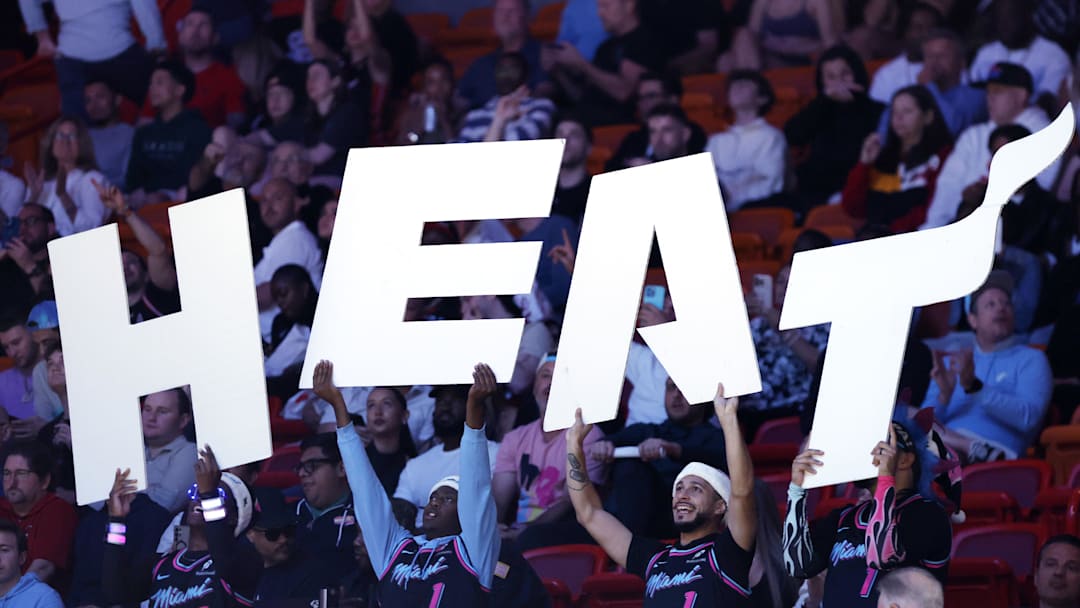 Dec 6, 2025; Miami, Florida, USA;  Member of the Miami Heat entertainment team, the Hoop Troop, hold a Heat sign against the Sacramento Kings during the second half at Kaseya Center. Mandatory Credit: Rhona Wise-Imagn Images