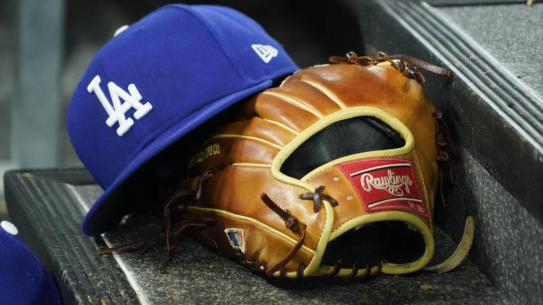 Apr 28, 2024; Toronto, Ontario, CAN; A hat and glove of an Los Angeles Dodgers player durng a game against the Toronto Blue Jays at Rogers Centre. Mandatory Credit: John E. Sokolowski-Imagn Images Apr 28, 2024; Toronto, Ontario, CAN; A hat and glove of an Los Angeles Dodgers player durng a game against the Toronto Blue Jays at Rogers Centre. Mandatory Credit: John E. Sokolowski-Imagn Images