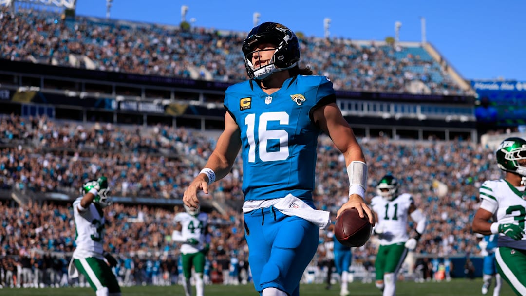 Jacksonville Jaguars quarterback Trevor Lawrence (16) scores a touchdown on a keeper during the first quarter of an NFL football matchup at EverBank Stadium, Sunday, Dec. 14, 2025, in Jacksonville, Fla. [Corey Perrine/Florida Times-Union]