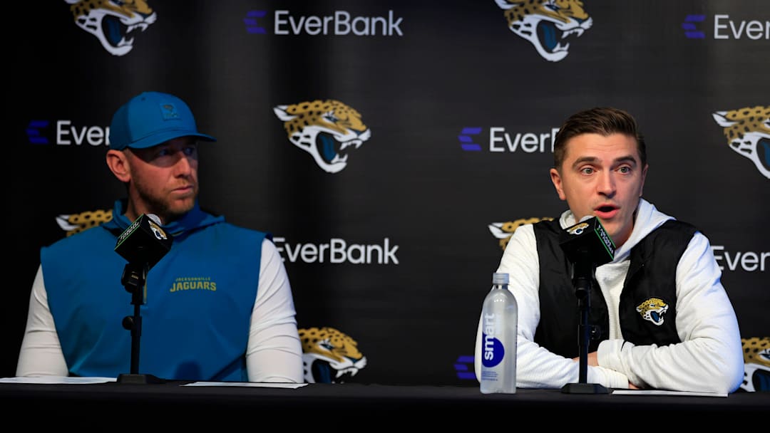 Jacksonville Jaguars general manager James Gladstone, right, speaks as head coach Liam Coen looks on during a press conference at the Miller Electric Center, Wednesday, Jan. 14, 2026, in Jacksonville, Fla.