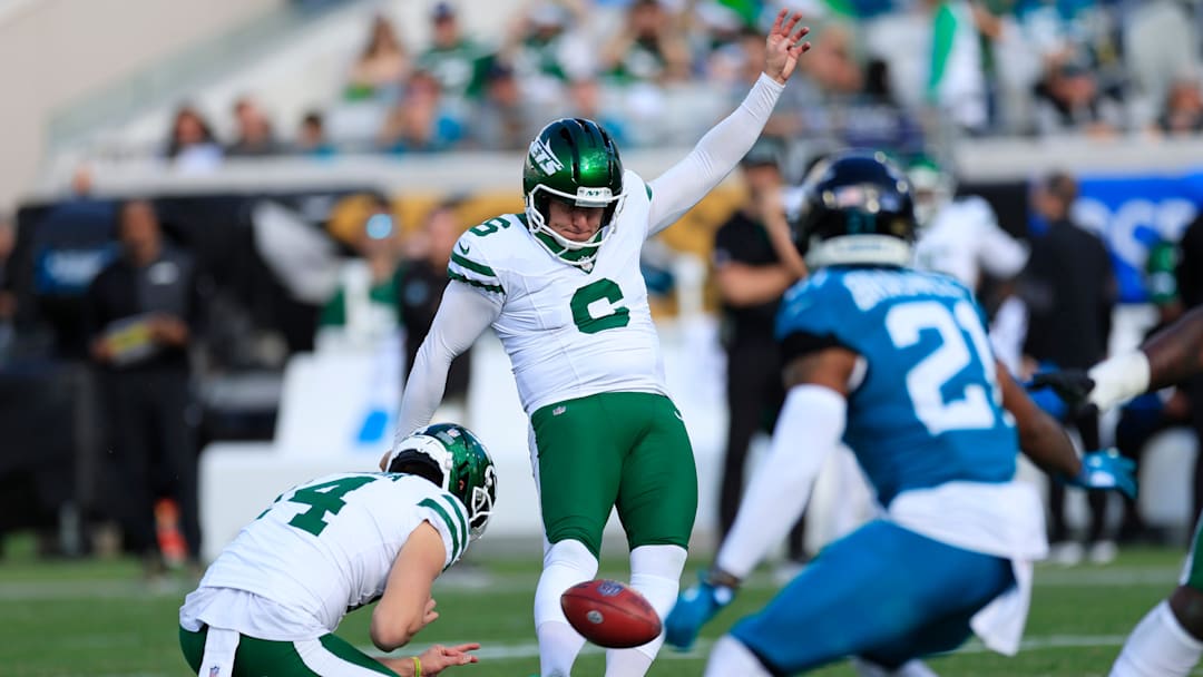 New York Jets place kicker Nick Folk (6) kicks a field goal as punter Austin McNamara (14) holds during the third quarter of a NFL football matchup at EverBank Stadium, Sunday, Dec. 14, 2025, in Jacksonville, Fla. The Jaguars defeated the Jets 48-20. [Corey Perrine/Florida Times-Union]