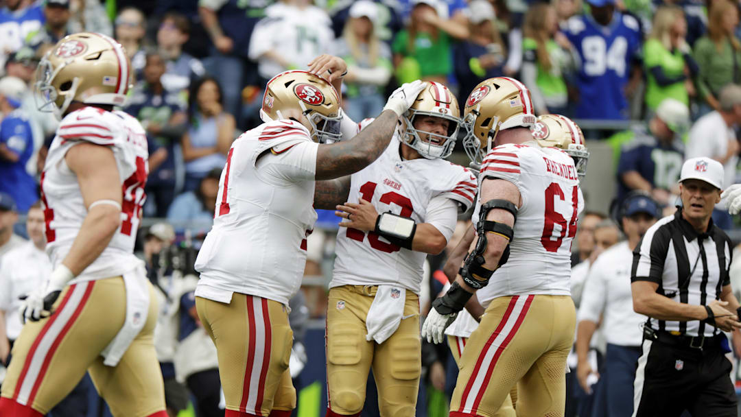 San Francisco 49ers quarterback Brock Purdy celebrates after throwing a touchdown pass against the Seattle Seahawks 