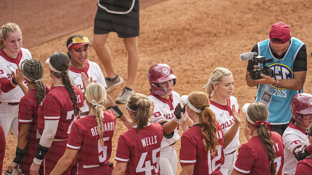 May 9, 2025; Athens, GA, USA; Oklahoma players shake hands with Arkansas players after the game at Jack Turner Softball Stadium. Mandatory Credit: Dale Zanine-Imagn Images
