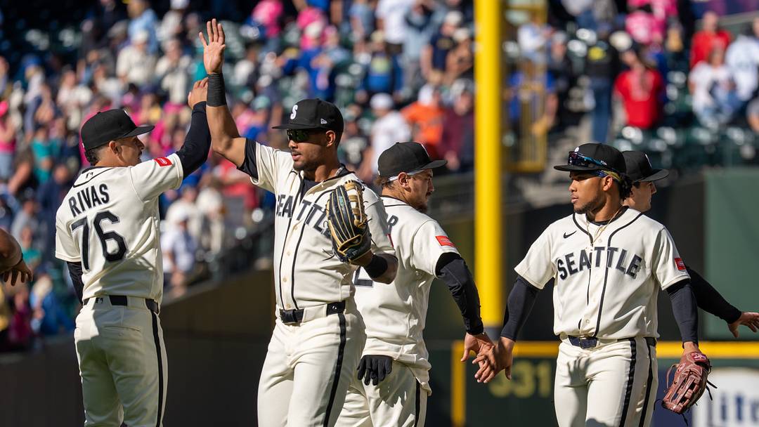 Sep 27, 2026; Seattle, Washington, USA; Seattle Mariners, from left, shortstop Leo Rivas (76), centerfielder Julio Rodriguez (44), first baseman Josh Naylor (12) and left fielder Michael Arroyo (96) celebrate after a game against the Los Angeles Angels at T-Mobile Park. Mandatory Credit: Stephen Brashear-Imagn Images Sep 27, 2026; Seattle, Washington, USA; Seattle Mariners, from left, shortstop Leo Rivas (76), centerfielder Julio Rodriguez (44), first baseman Josh Naylor (12) and left fielder Michael Arroyo (96) celebrate after a game against the Los Angeles Angels at T-Mobile Park. Mandatory Credit: Stephen Brashear-Imagn Images