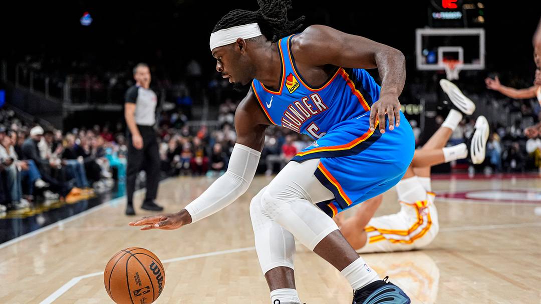 Oct 25, 2025; Atlanta, Georgia, USA; Oklahoma City Thunder guard Luguentz Dort (5) controls the ball against the Atlanta Hawks during the first half at State Farm Arena. Mandatory Credit: Dale Zanine-Imagn Images