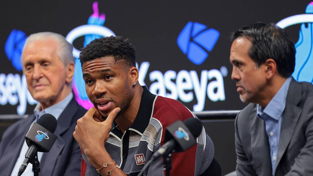 Jul 16, 2026; Miami, FL, USA; Miami Heat forward Giannis Antetokounmpo (center) speaks to reporters during his introductory press conference joined by Miami Heat president Pat Riley (left) and head coach Erik Spoelstra (right) at Kaseya Center. Mandatory Credit: Sam Navarro-Imagn Images