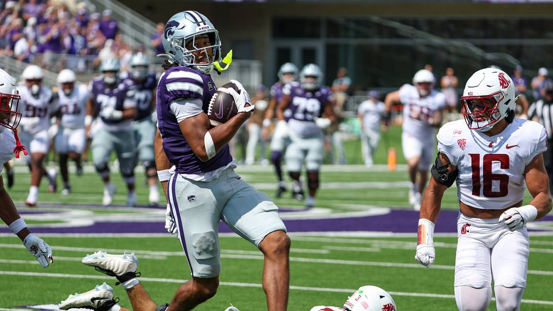 Sep 12, 2026; Manhattan, Kansas, USA; Kansas State Wildcats wide receiver Josh Manning (5) jumps over Washington State Cougars defensive back Jaylen Thomas (3) during the third quarter at Bill Snyder Family Football Stadium. Mandatory Credit: Scott Sewell-Imagn Images Sep 12, 2026; Manhattan, Kansas, USA; Kansas State Wildcats wide receiver Josh Manning (5) jumps over Washington State Cougars defensive back Jaylen Thomas (3) during the third quarter at Bill Snyder Family Football Stadium. Mandatory Credit: Scott Sewell-Imagn Images