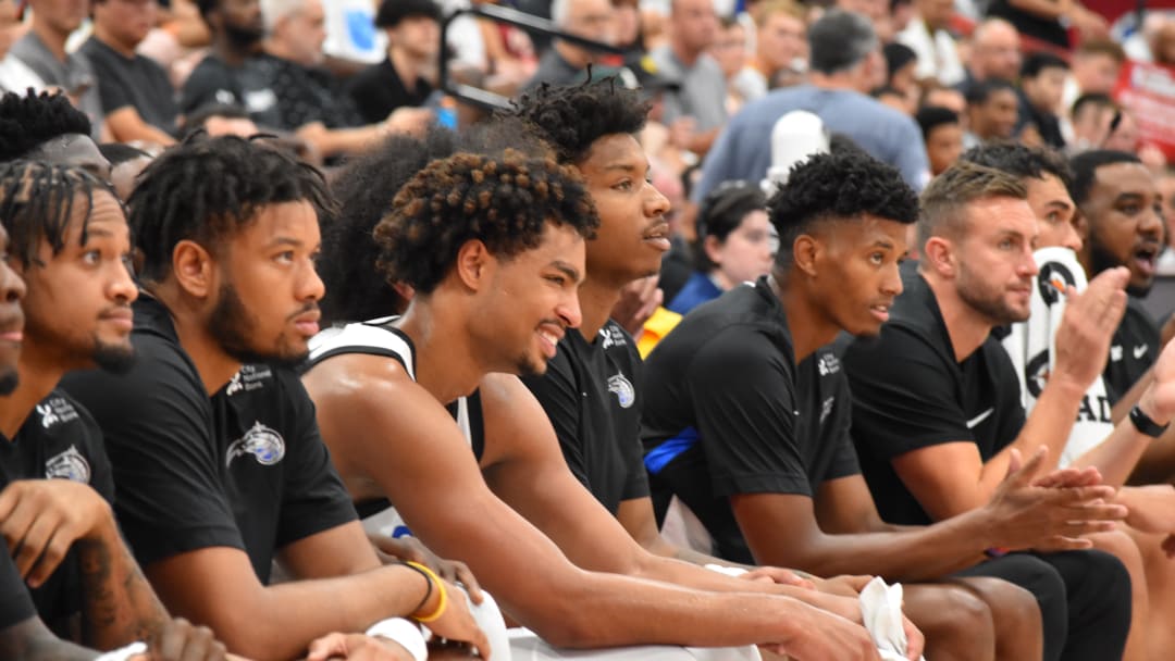 Orlando guard Jett Howard (third from left) is all smiles after scoring 22 points in the Magic's win over the Cleveland Cavaliers on Friday on the first day of the NBA Summer League. 