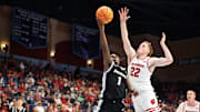 Nov 27, 2025; San Diego, CA, USA; Providence Friars guard Jason Edwards (1) shoots the ball against Wisconsin Badgers forward Austin Rapp (22) during the first half at Jenny Craig Pavilion.