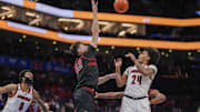 Mar 13, 2025; Charlotte, NC, USA; Stanford Cardinal forward Maxime Raynaud (42) blocks a shot by Louisville Cardinals guard Chucky Hepburn (24) during the second half at Spectrum Center. Mandatory Credit: Jim Dedmon-Imagn Images