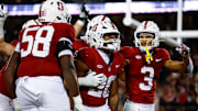 Nov 22, 2025; Stanford, California, USA; Stanford Cardinal running back Micah Ford (20) celebrates with teammates after scoring a touchdown during the fourth quarter against the California Golden Bears at Stanford Stadium. Mandatory Credit: Sergio Estrada-Imagn Images