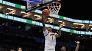 Mar 11, 2025; Charlotte, NC, USA; Virginia Tech Hokies forward Tobi Lawal (1) goes to the basket defended but California Golden Bears forward Lee Dort (34) during the second half at Spectrum Center. Mandatory Credit: Jim Dedmon-Imagn Images