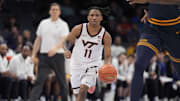 Mar 11, 2025; Charlotte, NC, USA; Virginia Tech Hokies guard Ben Hammond (11) brings the ball up court during OT against the California Golden Bears at Spectrum Center. Mandatory Credit: Jim Dedmon-Imagn Images