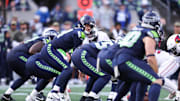 Nov 9, 2025; Seattle, Washington, USA;  Seattle Seahawks quarterback Sam Darnold (14) prepares to take a snap during the second quarter against the Arizona Cardinals at Lumen Field. Mandatory Credit: Kevin Ng-Imagn Images