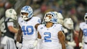 Sep 6, 2025; Charlotte, North Carolina, USA; North Carolina Tar Heels linebacker Andrew Simpson (2) celebtates his sack along with linebacker Tyler Thompson (40) during the second half against the Charlotte 49ers at Jerry Richardson Stadium. 