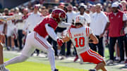 Nov 16, 2024; Tuscaloosa, AL, USA; Alabama Crimson Tide linebacker Qua Russaw (4) is called for a horse collar tackle on Mercer wide receiver Parker Wroble (10) at Bryant-Denny Stadium. Mandatory Credit: Gary Cosby Jr.-Tuscaloosa News